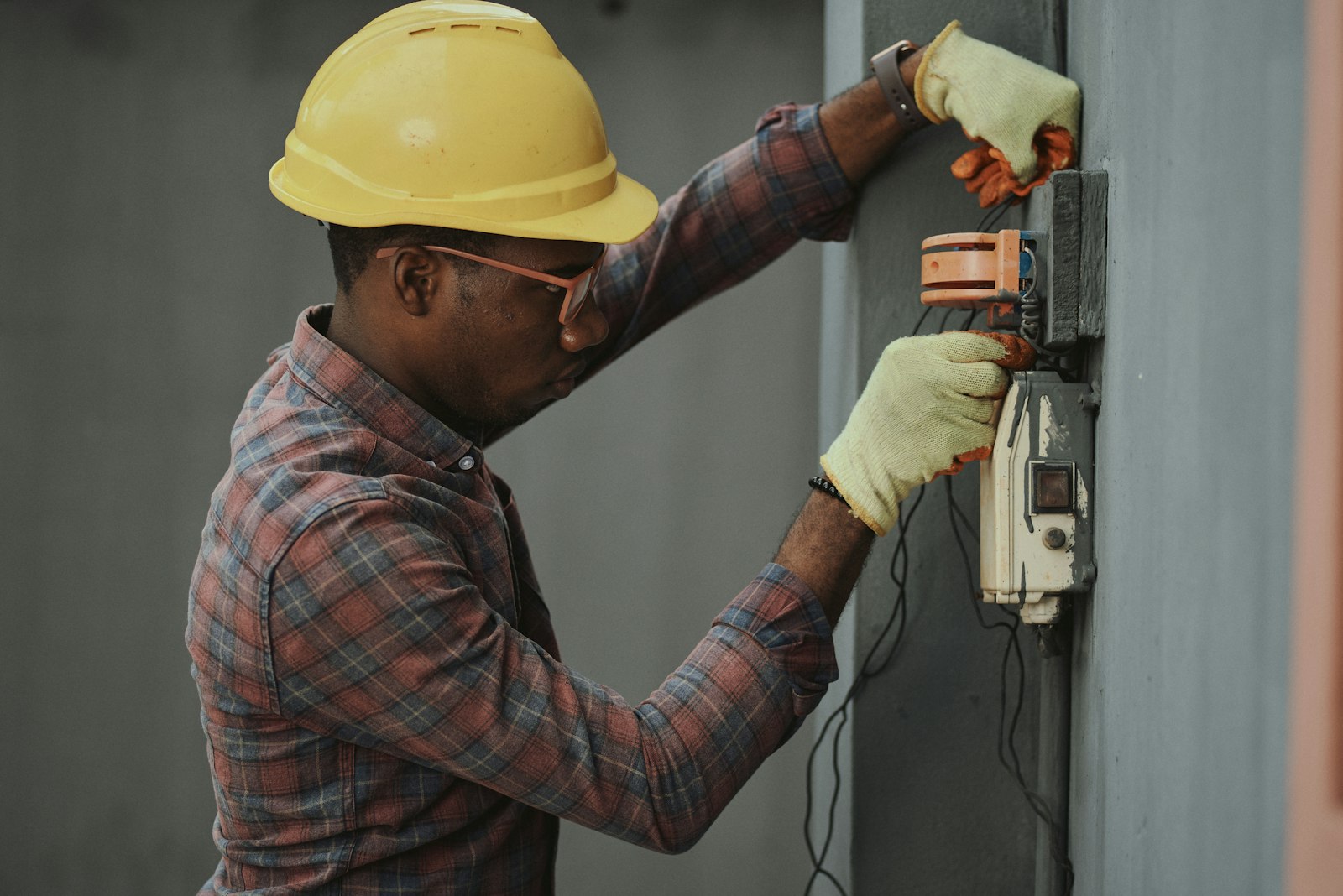 Technician working on an electrical panel